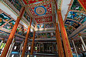 Vientiane, Laos - Pha That Luang, among the Other structures on the ground there is an open sala decorated with brightly colored paintings. 